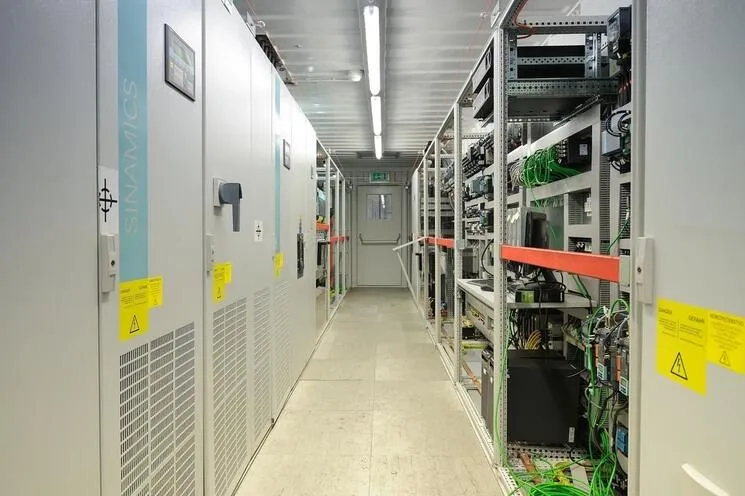 A row of cabinets with SIEMENS equipment