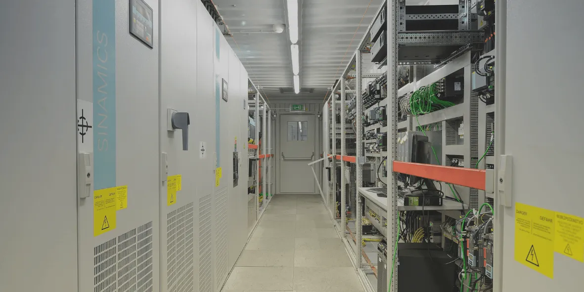 A row of switchboards with frequency converters